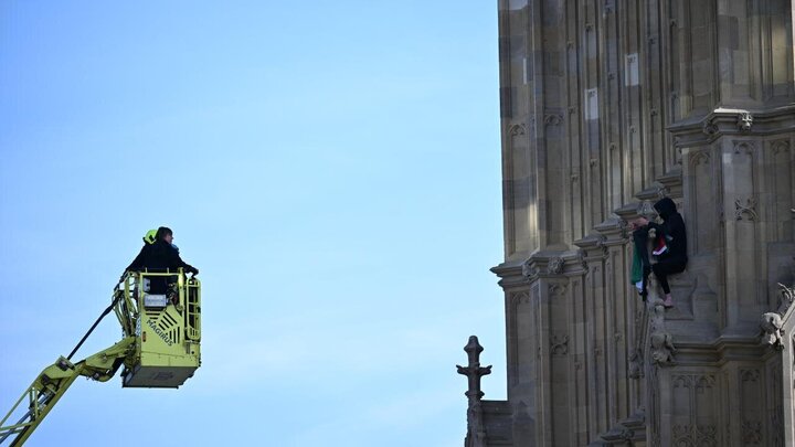 Photos: Young man with Palestinian flag climbs Big Ben clock tower in London