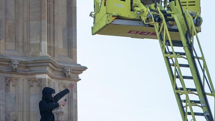 Photos: Young man with Palestinian flag climbs Big Ben clock tower in London