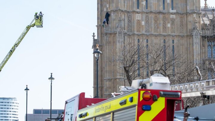 Photos: Young man with Palestinian flag climbs Big Ben clock tower in London