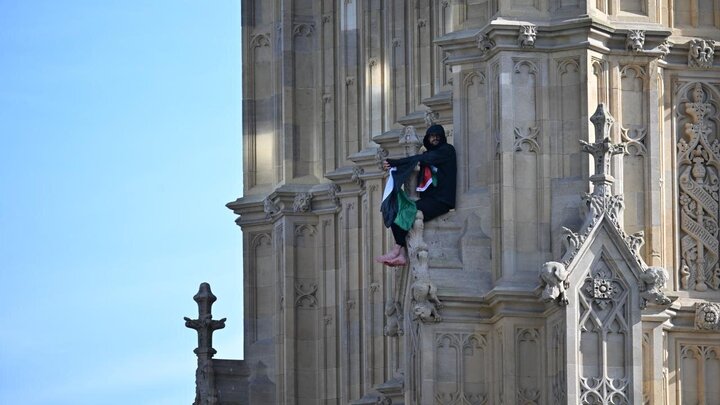 Photos: Young man with Palestinian flag climbs Big Ben clock tower in London