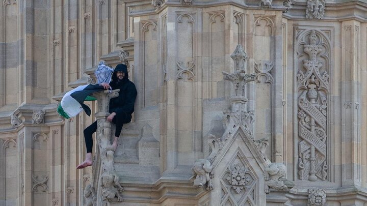Photos: Young man with Palestinian flag climbs Big Ben clock tower in London