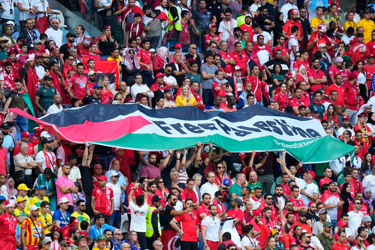 Tunisian student arrested for storming pitch, waving Palestinian flag during World Cup qualifier