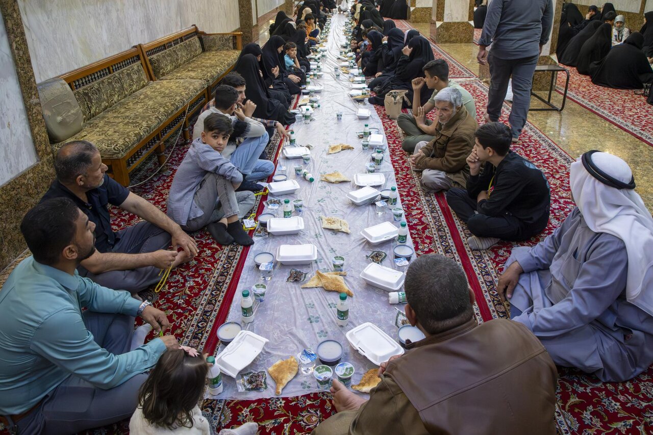 Al-Abbas holy shrine holds an Iftar banquet for a number of martyrs' families in Karbala