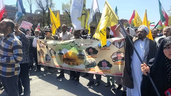 Photos: Fatemiyoun fighters, Afghan immigrants participate in Quds Day march