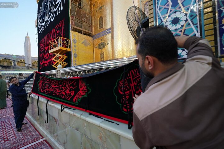 Photos: Imam Ali holy shrine covered in black on eve of Muharram