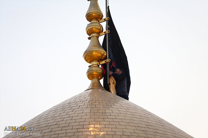 Photos: Changing flag of Hazrat Masoumeh shrine's dome ahead of Muharram