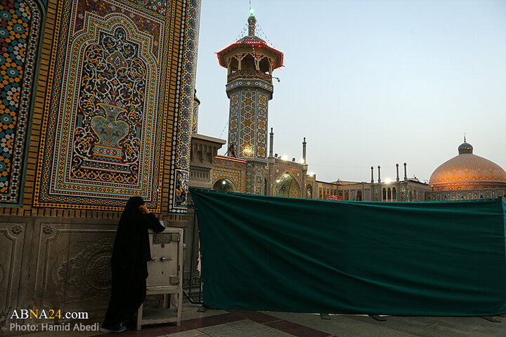 Photos: Changing flag of Hazrat Masoumeh shrine's dome ahead of Muharram