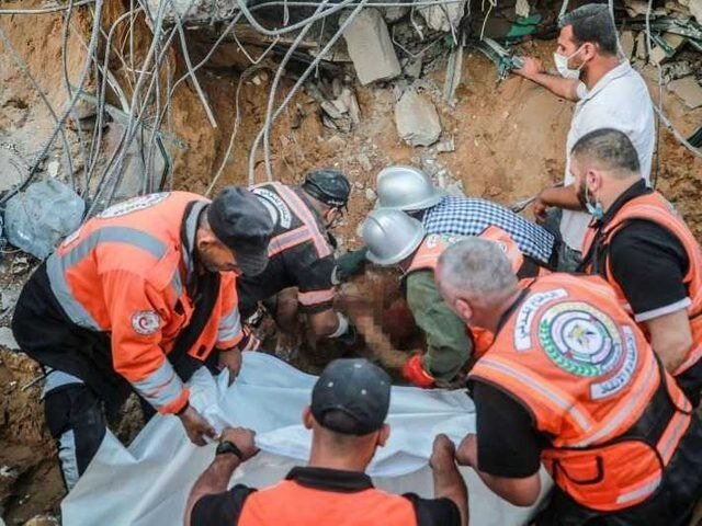 Gaza Civil Defense recovers bodies of 14 Palestinians from rubble of house in Maghazi camp