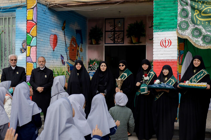 Photos: Distribution of jackets, cultural items by servants of Imam Reza holy shrine