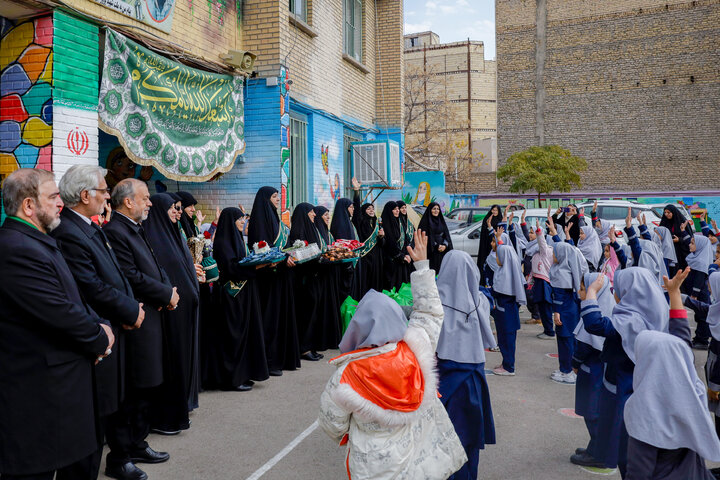 Photos: Distribution of jackets, cultural items by servants of Imam Reza holy shrine