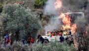 Zionist settlers torch vehicles, spray racist slogans in attack on Atara, north of Ramallah