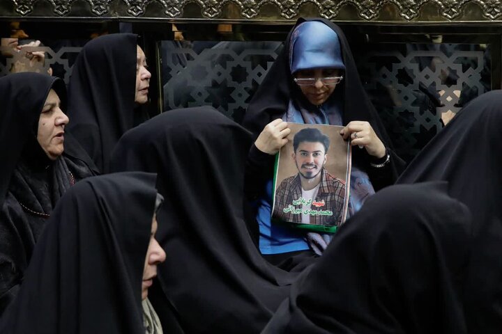 Photos: Dust-cleaning ceremony of Imam Reza holy shrine attended by families of martyrs of recent unrest