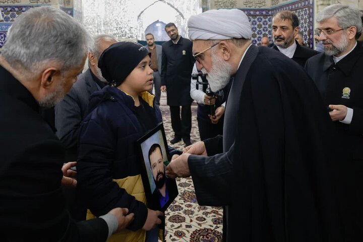 Photos: Dust-cleaning ceremony of Imam Reza holy shrine attended by families of martyrs of recent unrest