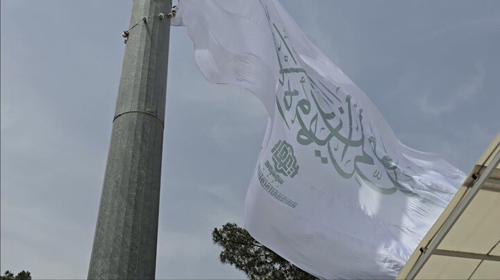 Photos: Holy flag of Imam Ali Shrine raised in Qom