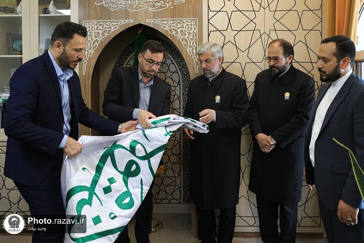 Photos: Donation of the Ghadiriyah Flag of Alawi Shrine to Astan Quds Razavi