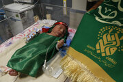 Photos: Sick Children Dressed in Garment of Hazrat Ali Asghar (a.s.)