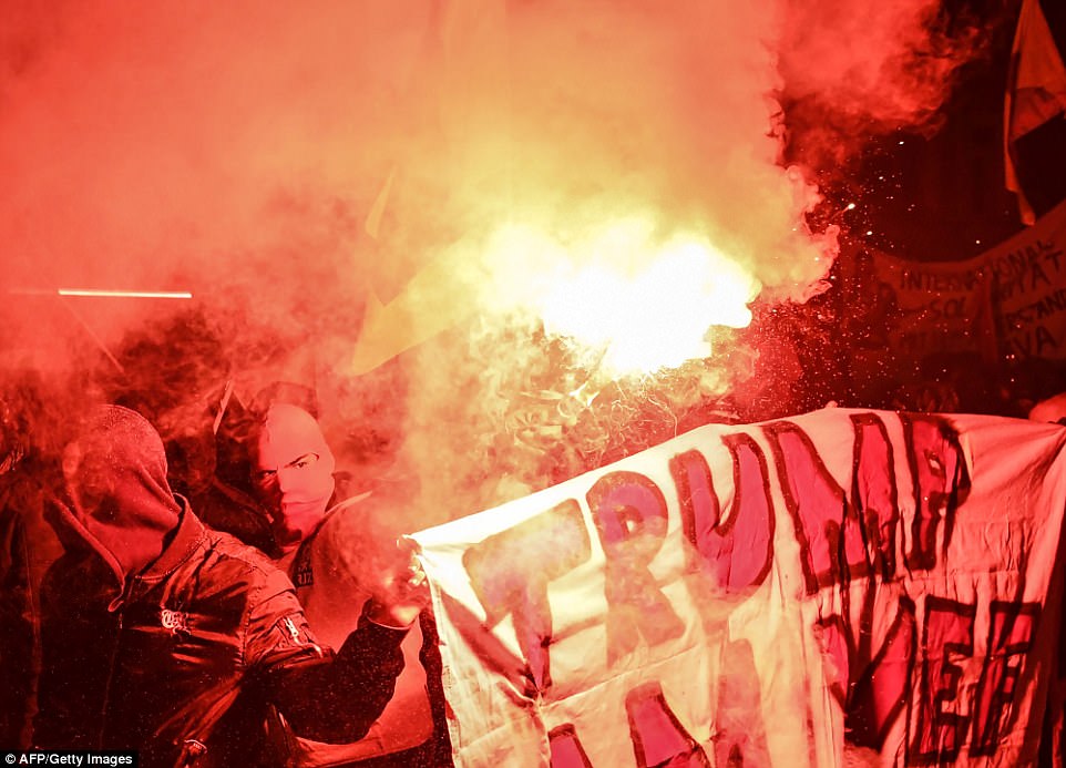 Thousands of anti-Trump protesters flood streets of Swiss against his visit to World Economic Forum in Davos